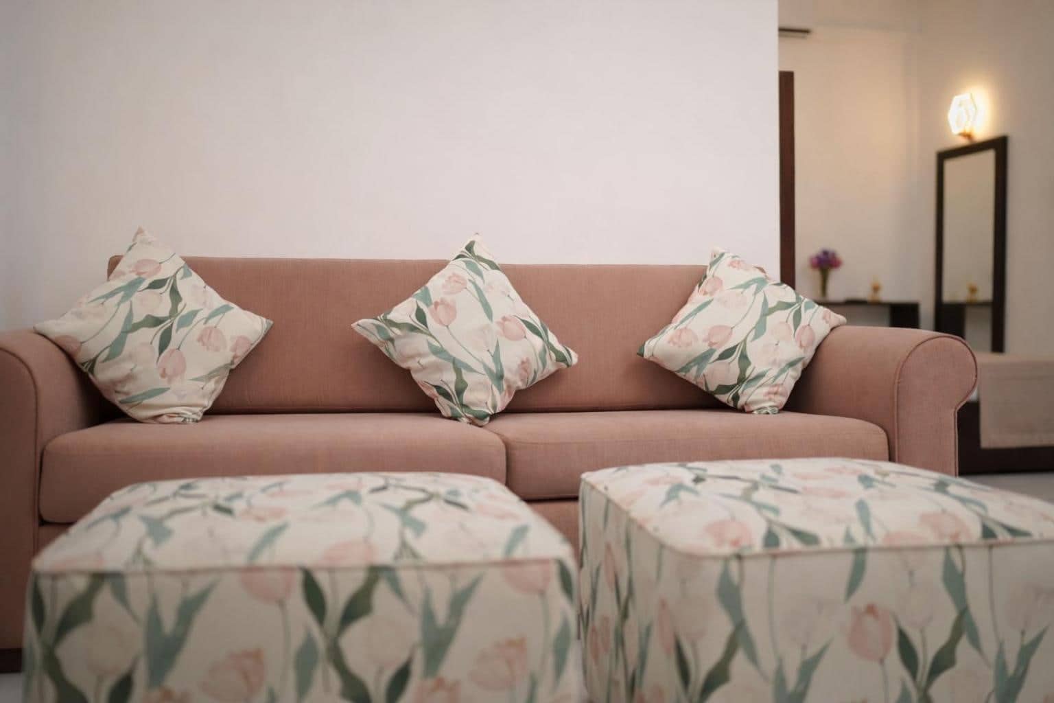 Floral sofa and ottomans in the room lounge corner